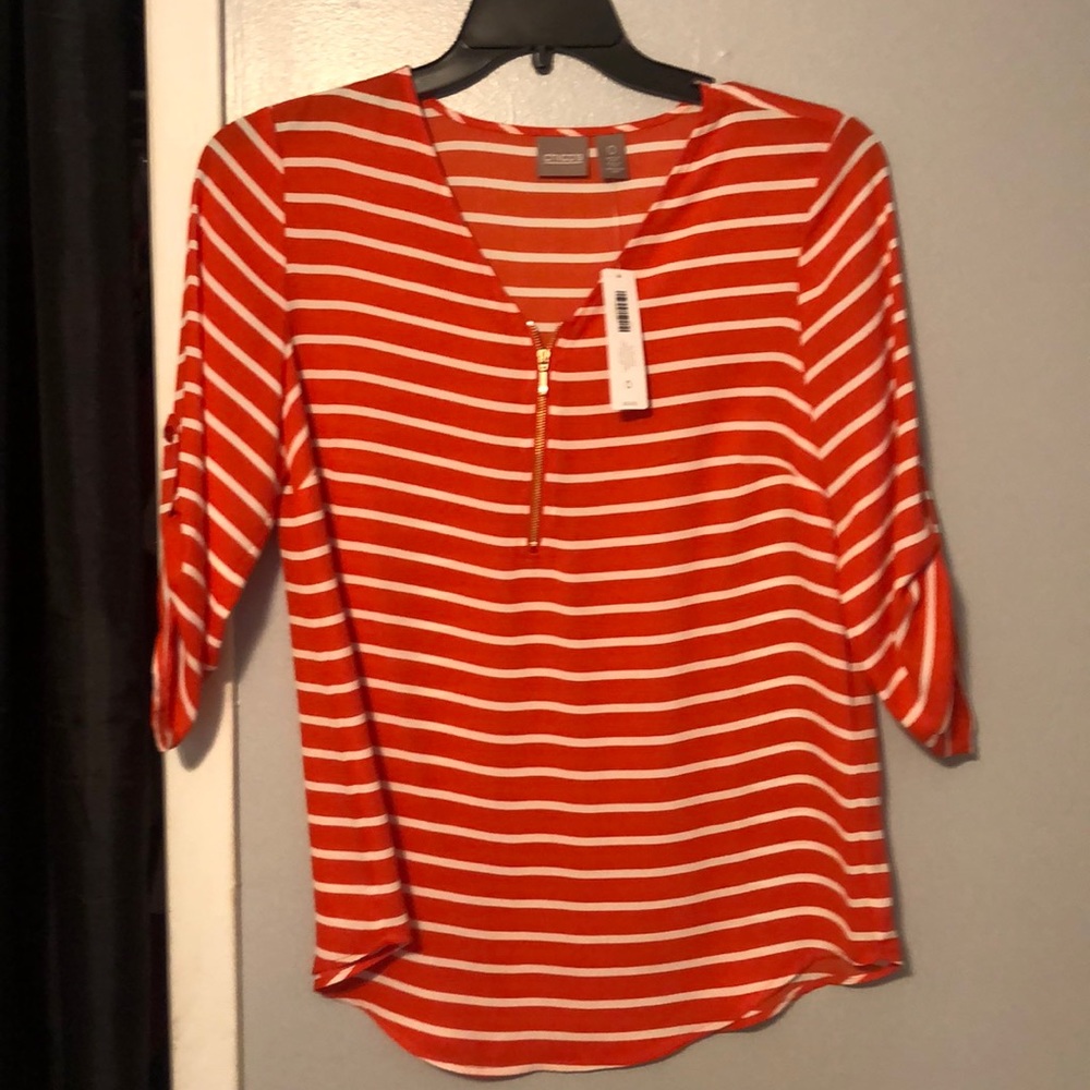 Orange and White Stripe Shirt With Gold Zipper.